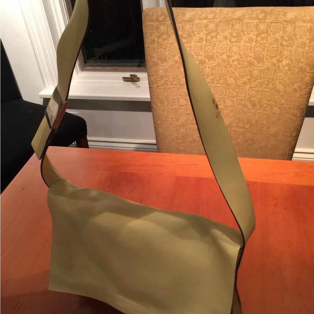 Miu Miu Unisex messenger style bag in beautiful calf shin. Barely used.
